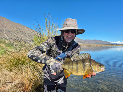 WFR252646.54 John Hey with a 3.5lbs perch from the Ashburton Lakes area caught on a Mrs Simpson red body on Opening Morning.