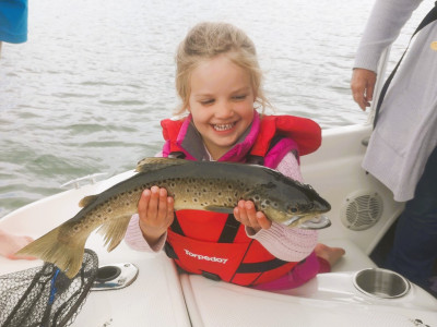 WFR2425 89 Elise Marshall age 4 beaming with pride over her very first fish caught at Lake Opuha.