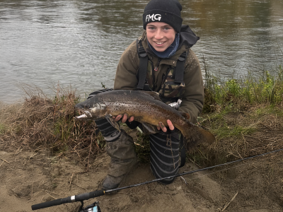 WFR2526.06 Ryan Harrison, age 12, with his first fish of the season. A 4.5lbs brown from the Ōpihi river