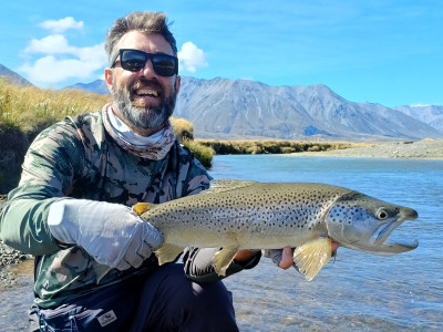 WFR2425 129  Jeremy with a stunning high country brown caught on a cicada fly pattern.