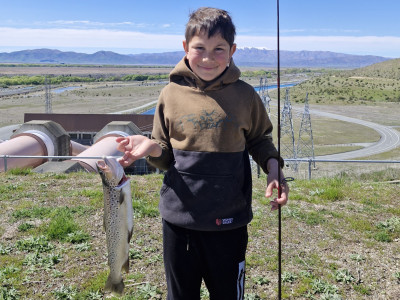 WFR2425 18 Monty Kendall with his first freshwater fish 2.5lb Brown trout from Ohau B canal