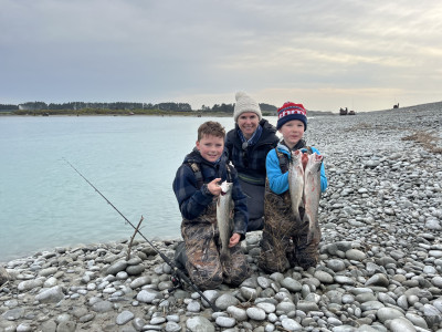 WFR2425.04 Ronelle Van Dongen with her two sons Archie right and Thomas left savouring success at the Rangitata mouth on Opening Day