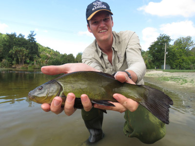 WFR1819.52Fish Game Officer Hamish Stevens displays a Centennial Park tench Credit R Adams