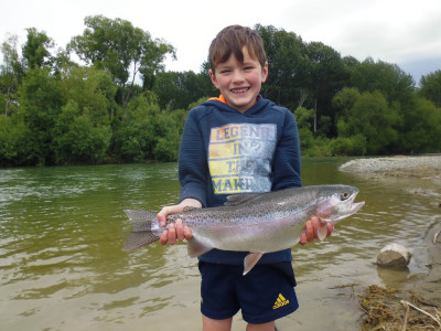WFR1819.24 Finn Stevens display his rare catch a rainbow trout from the Opihi River photo credit H Stevens