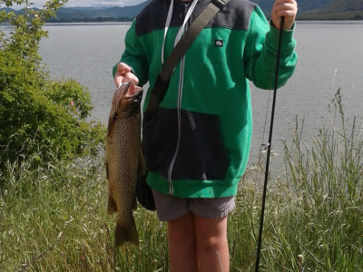 WFR1819.21Jack Gillespie 9 with his brown trout caught in discoloured waters at the Ahuriri Arm Lake Benmore credit A Gillespie