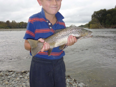 WFR1718.55 Cameron Blogg with his first fish a brown trout from the Opihi River