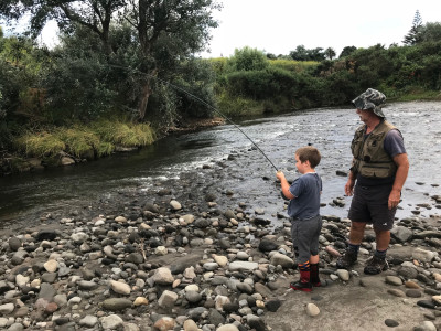 TRL2Sept18. Murray Dobbin watches on as grandson Wyatt plays a fish