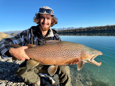 Scott Miller presents his 20 pound tagged brown trout before release back to the Tekapo Canal Photo credit Morgan Brown
