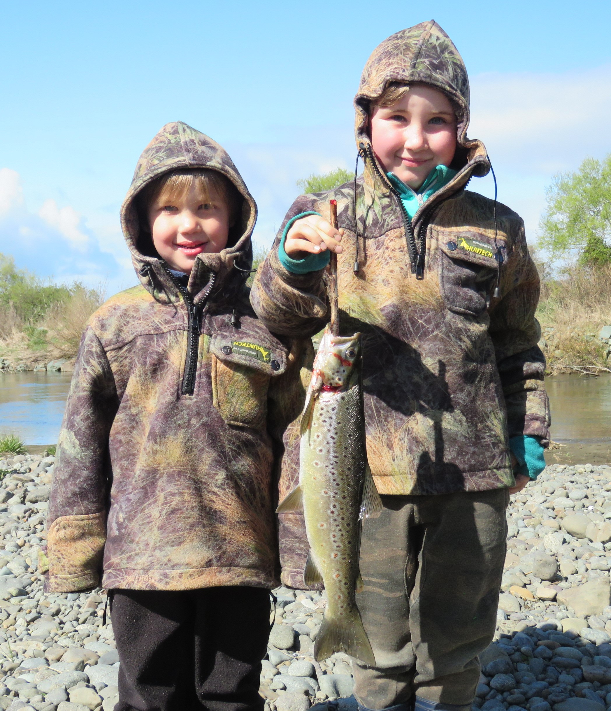Young bait fishing anglers Oscar and Lenny Pickard catch a nice fish on the Aparima River