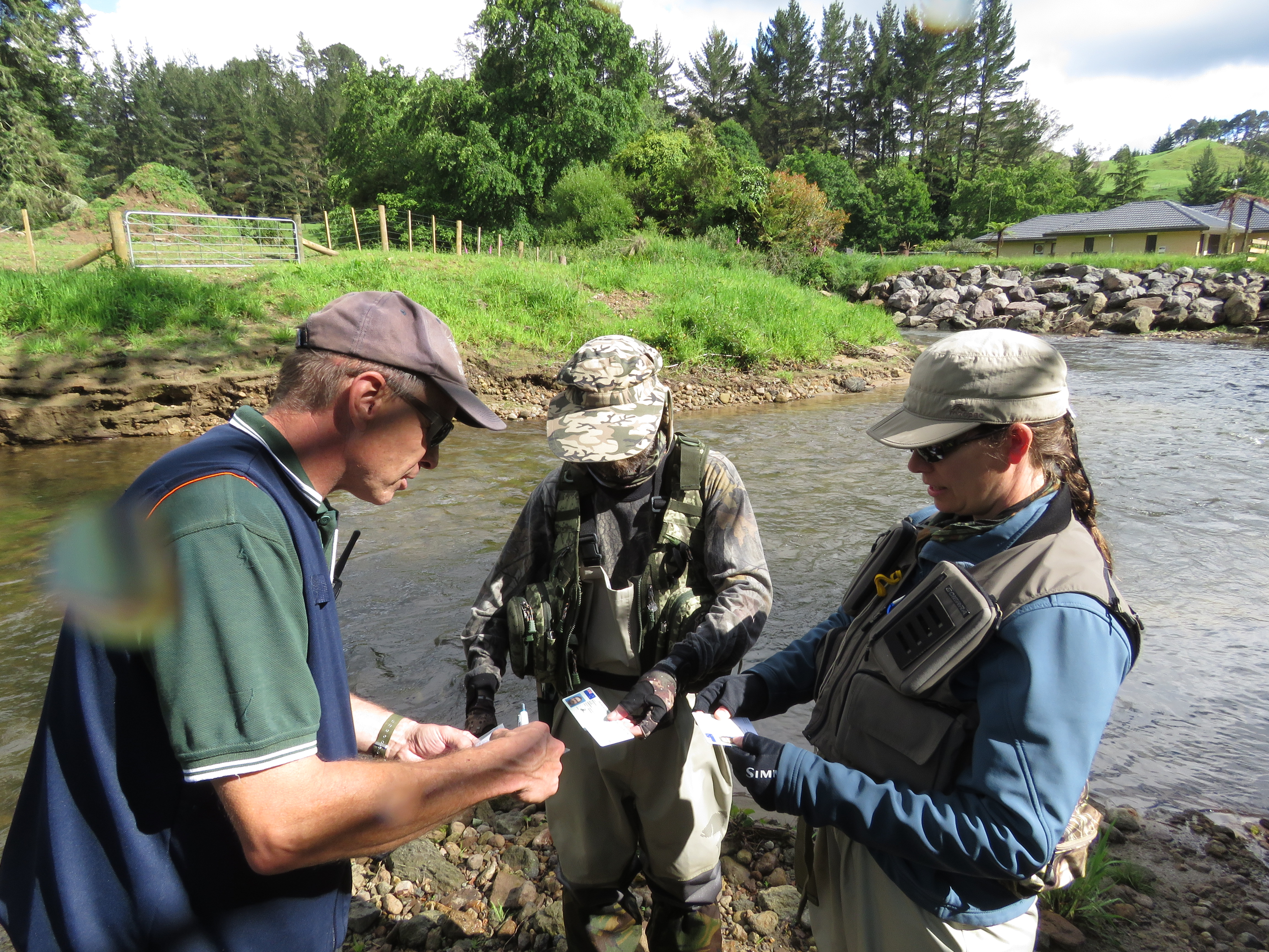 Anthony van Dorp checks licences on the Ngongotaha Stream.