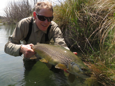 RLdec18csi1 Fish Game Officer Rhys Adams with 6 pound of CSIs finest brown trout credit J Couper