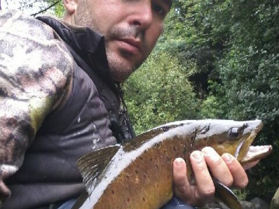 TRL2Feb18 Hawera angler Carlos Cardoso do Vale shows off his first brown trout of the season taken on a cicada 12 February 2018.