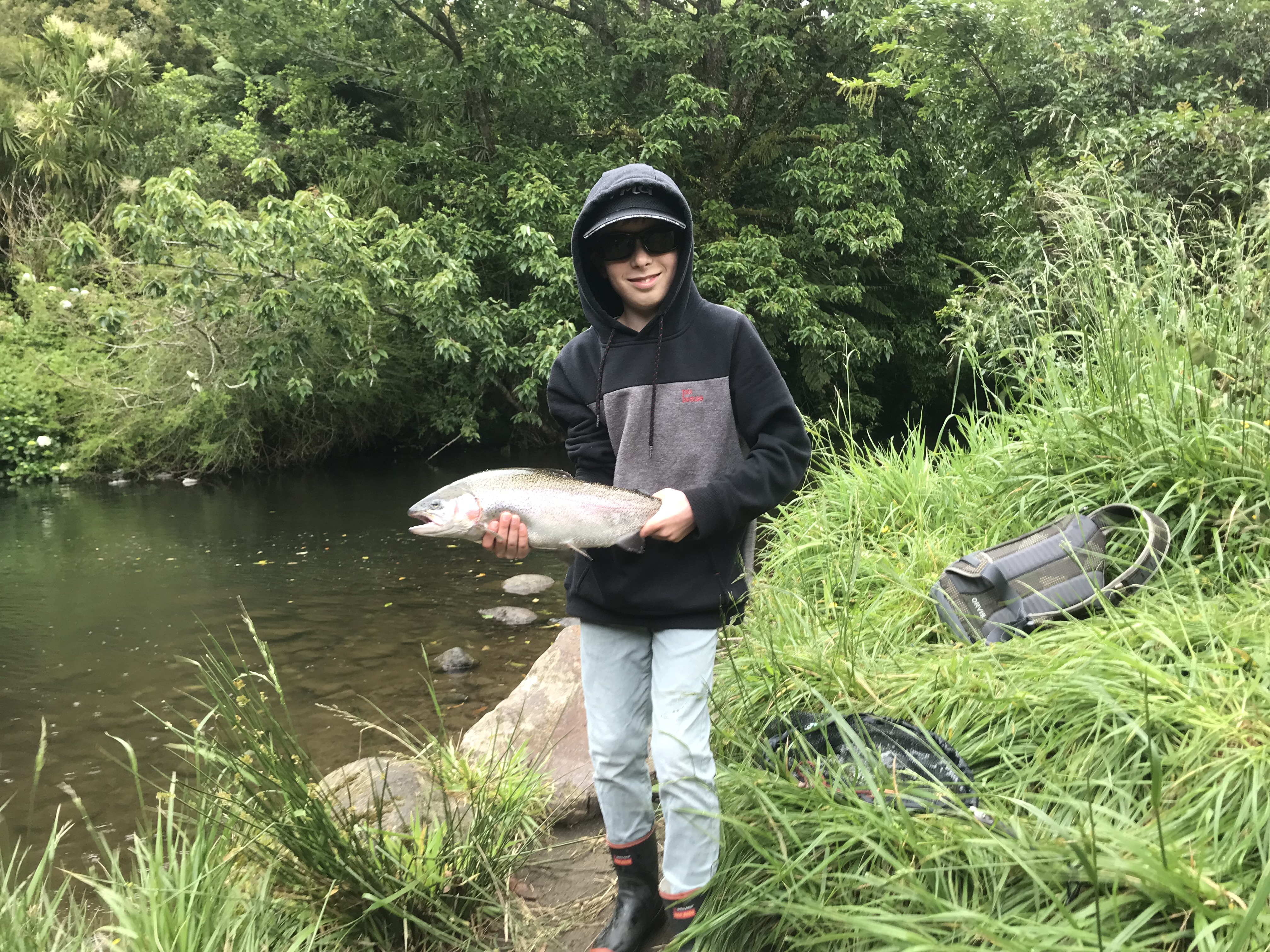 TRL2Dec21 Sean Robinson with a rainbow from the Scout Den pool. Photo Caleb Robinson
