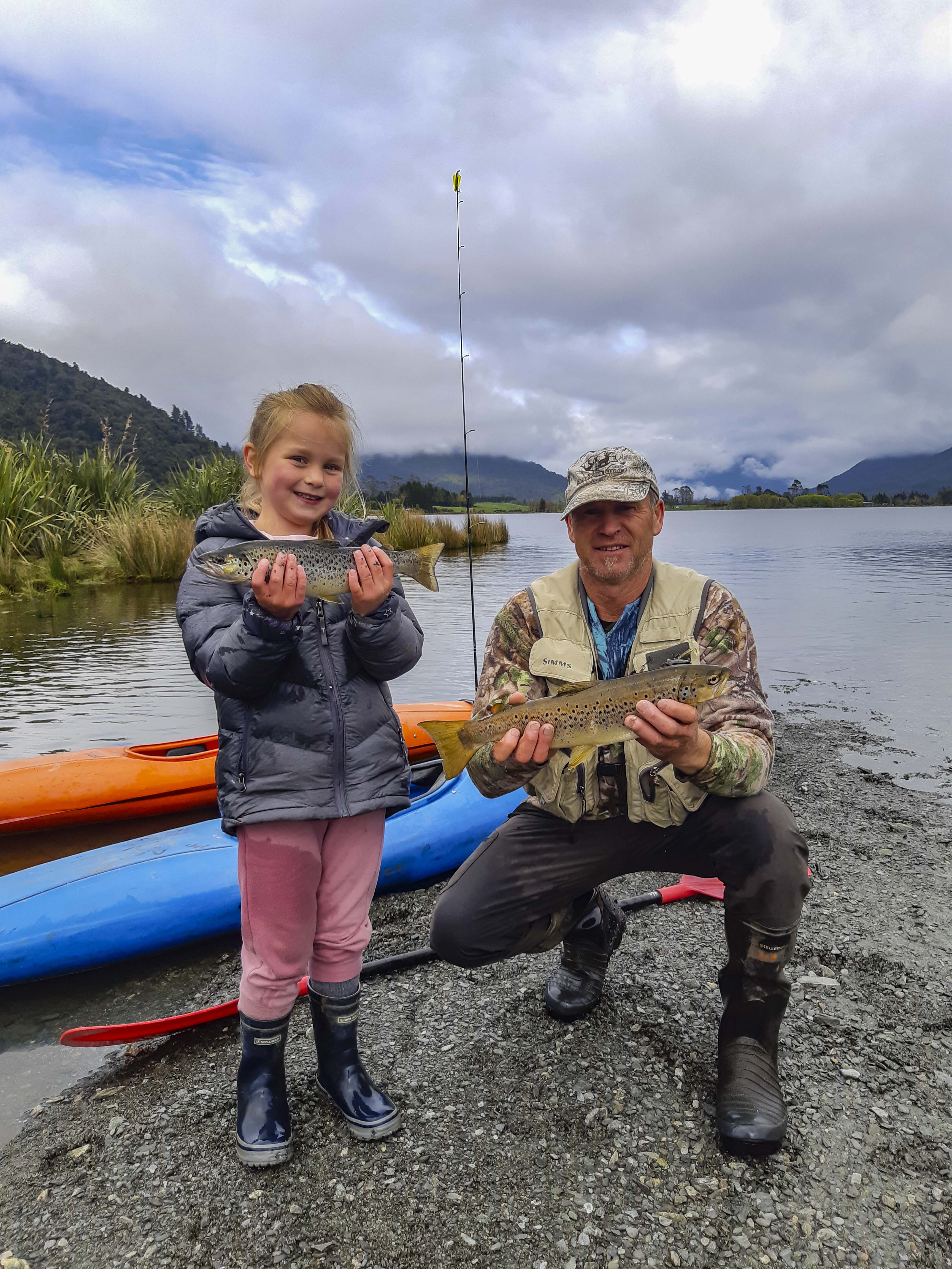 Kyah Sutherland got her school holidays off to a great start catching her first trout with her grandfather Lyndon Sutherland. Photo Baylee Kersten 1