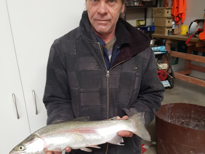 Russell Daniels with a trout caught from Whau Valley Dam on 24 August 2018 2