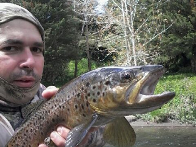 TRL1Oct18. Carlos Cardoso do Vale shows off his first Waingongoro River brown trout of the new season.