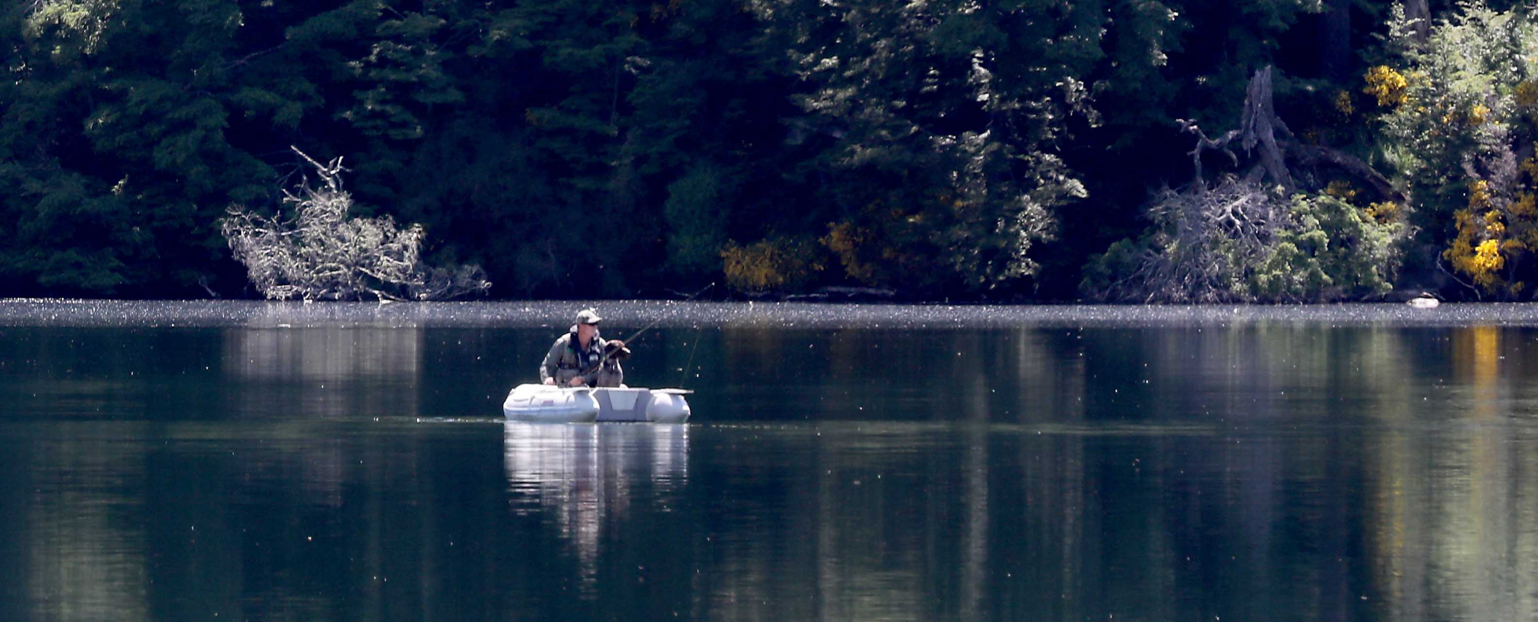 WFR 1 A rising fish gets the attention of both dog and angler