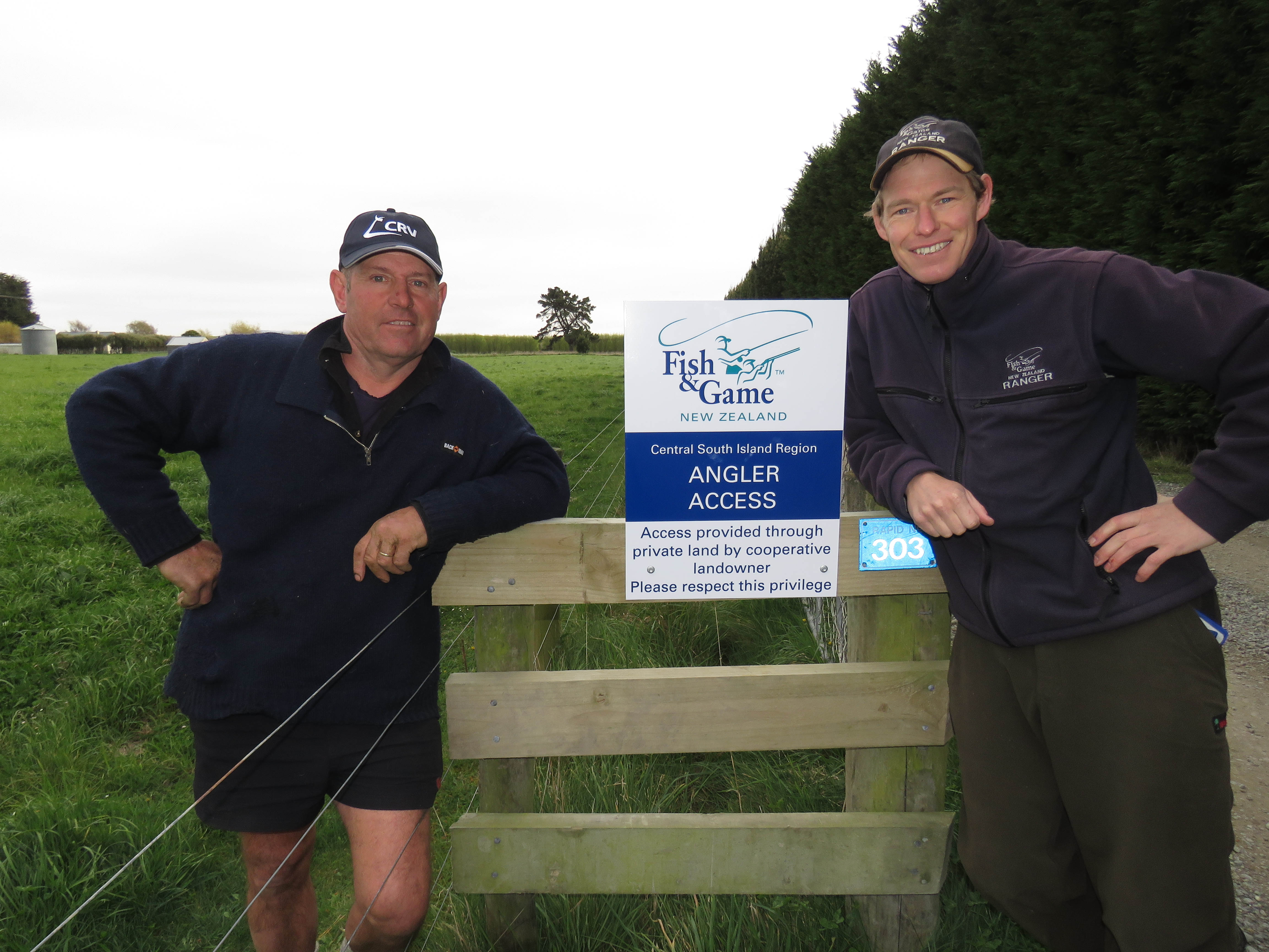 WFR1920.07 Waitaki farmer Geoff Taylor and Fish Game Officer Rhys Adams with a newly installed angler access signage on Geoffs Kaik Road farm 1