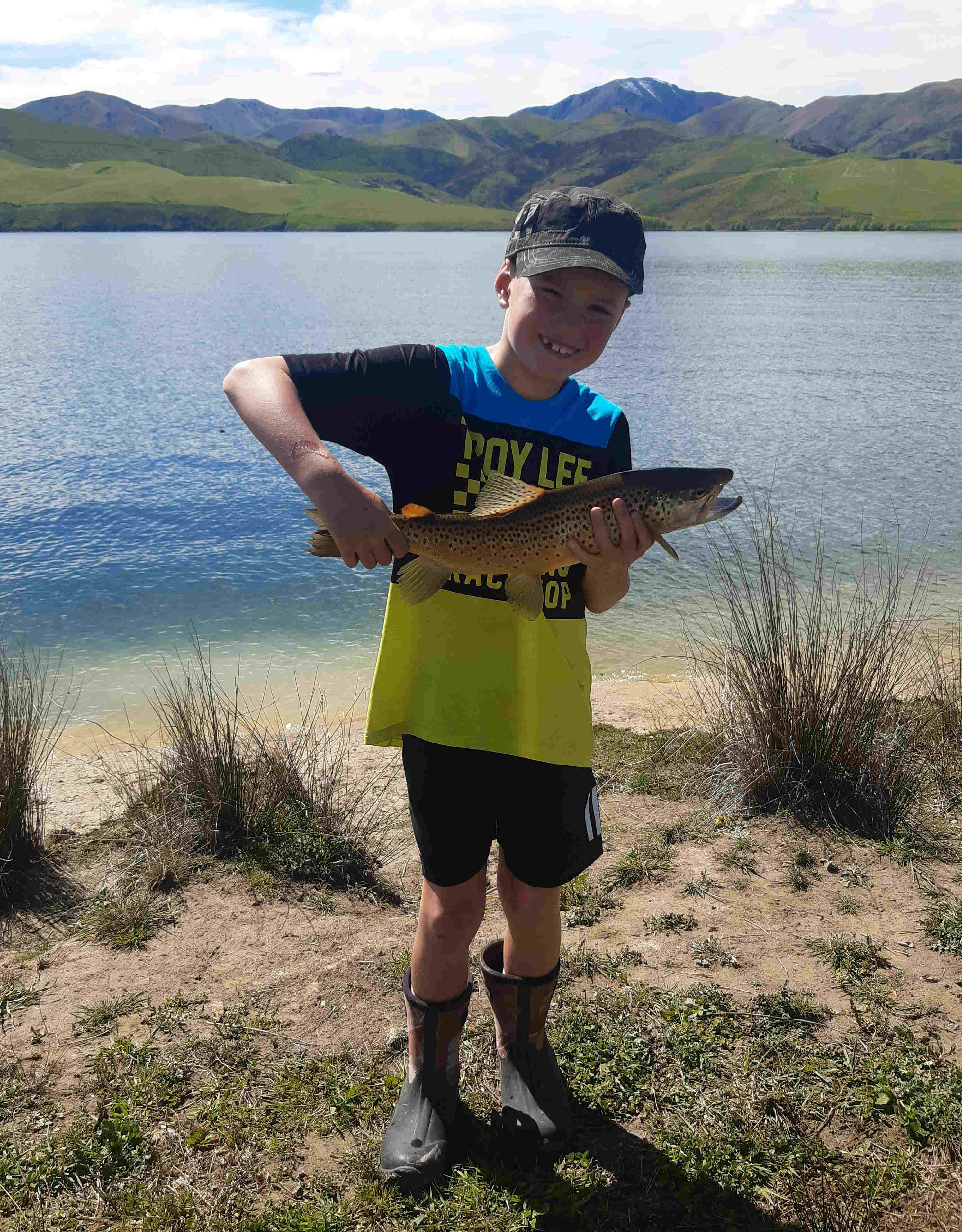 Finn Stevens and his Lake Opuha brown trout Credit K Stevens