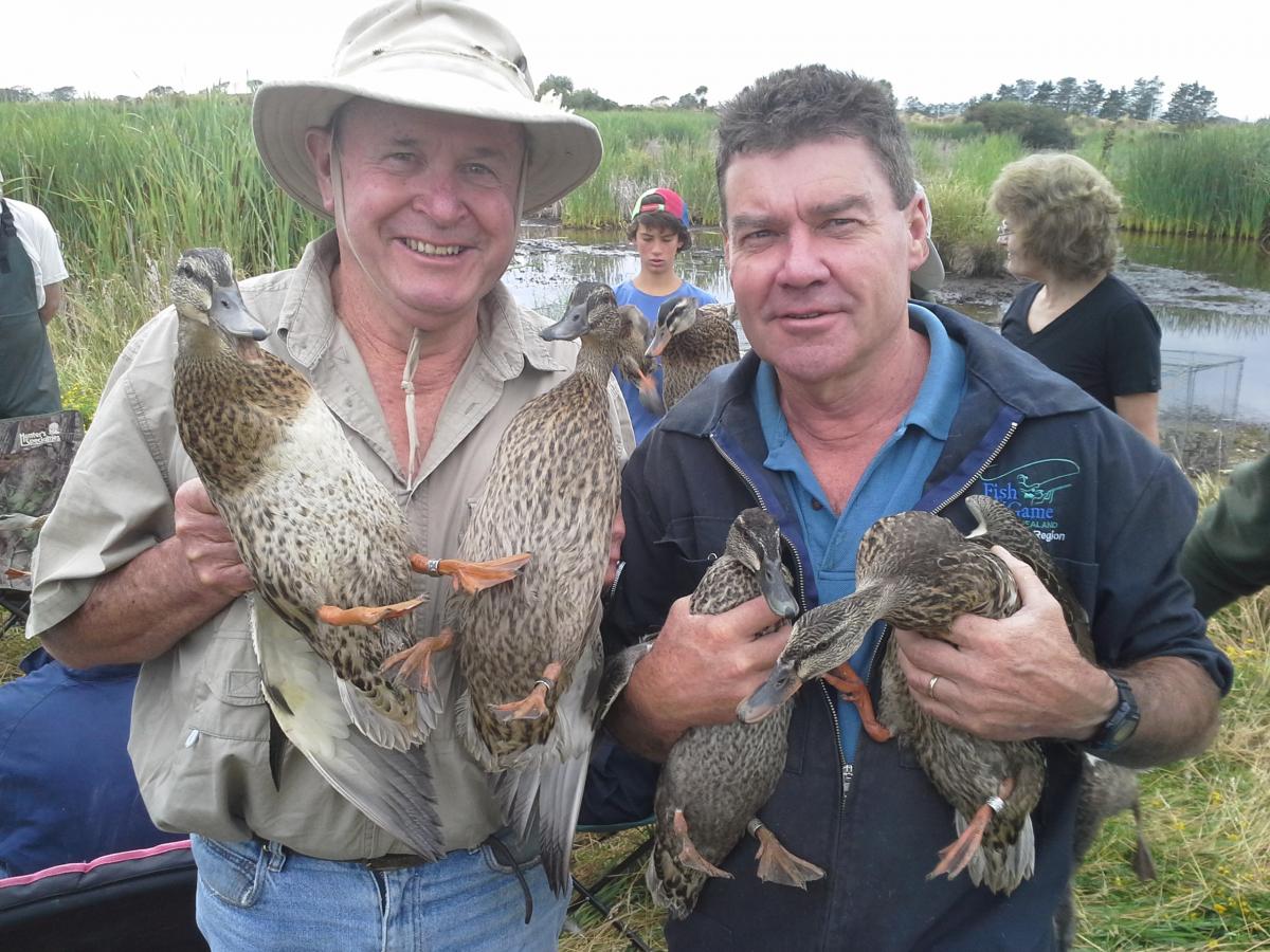 2 Hands on...Fish and Game Chairman Lindsay Lyons left and Eastern Manager Andy Garrick.