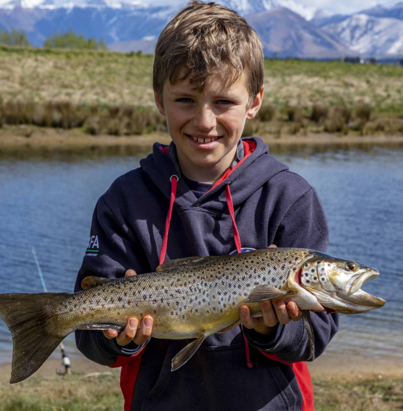 FGNZ7385a Nine year old Blake Marrett had success with wormfishing on Lake Opuha with this lovely brown trout